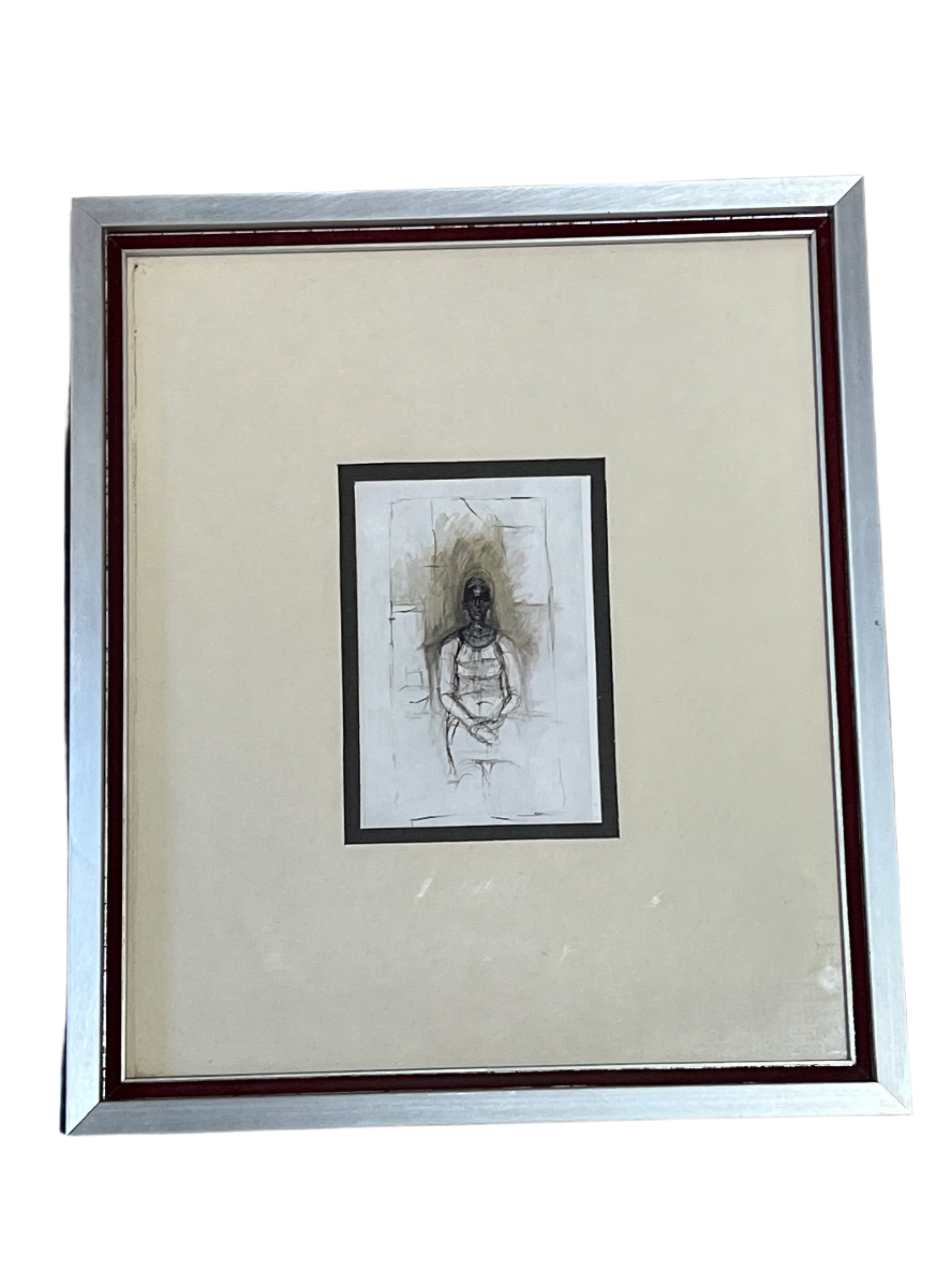 figure matted in silver frame