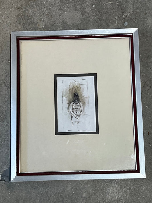 figure matted in silver frame