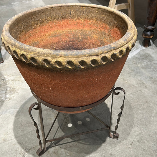 Terra Cotta pot with braided edge.