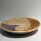 Woven basket with brown and purple