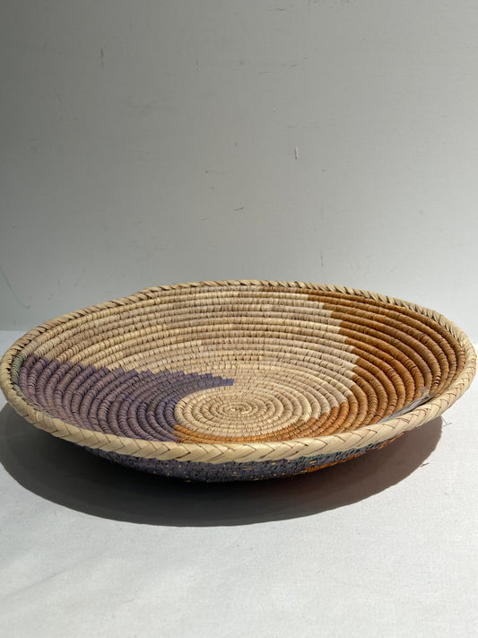 Woven basket with brown and purple