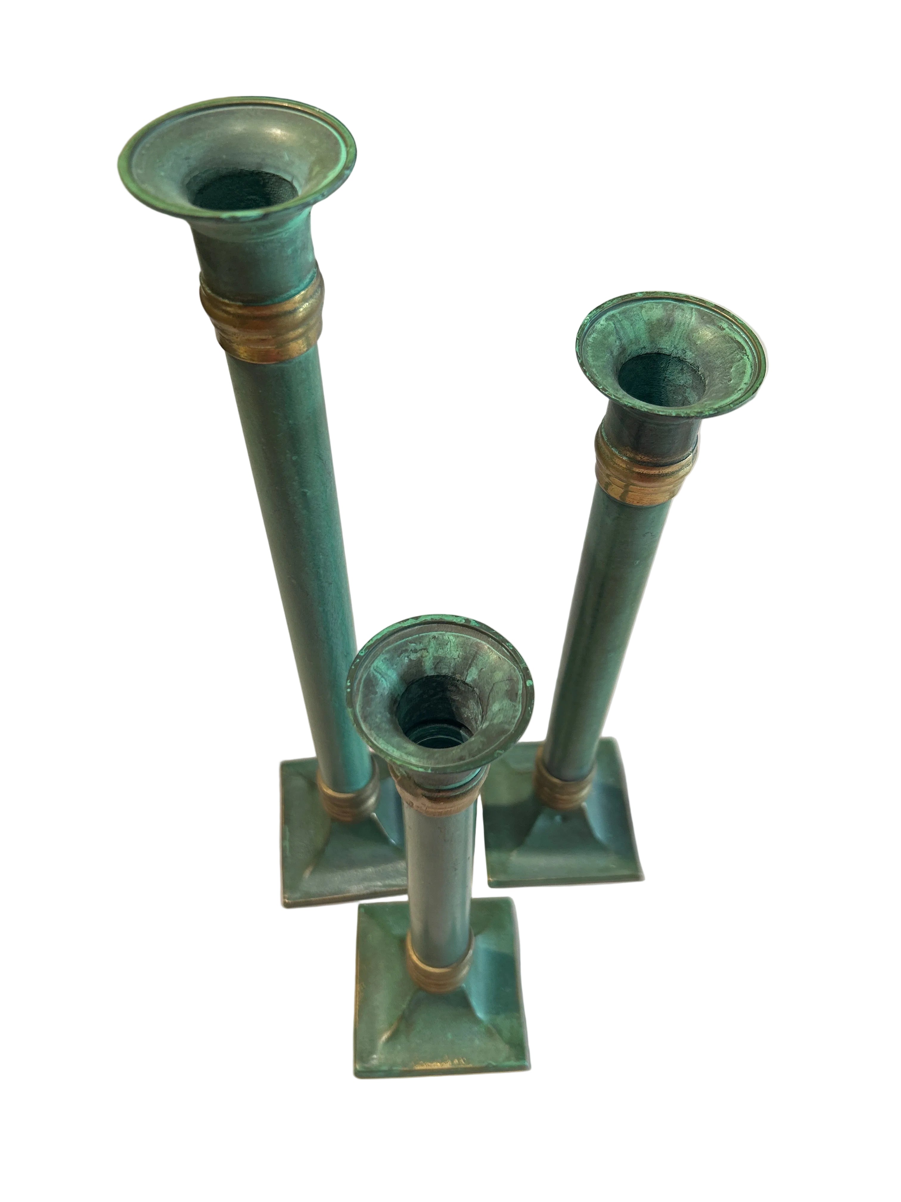 Vintage set of three patina’d brass candle holders