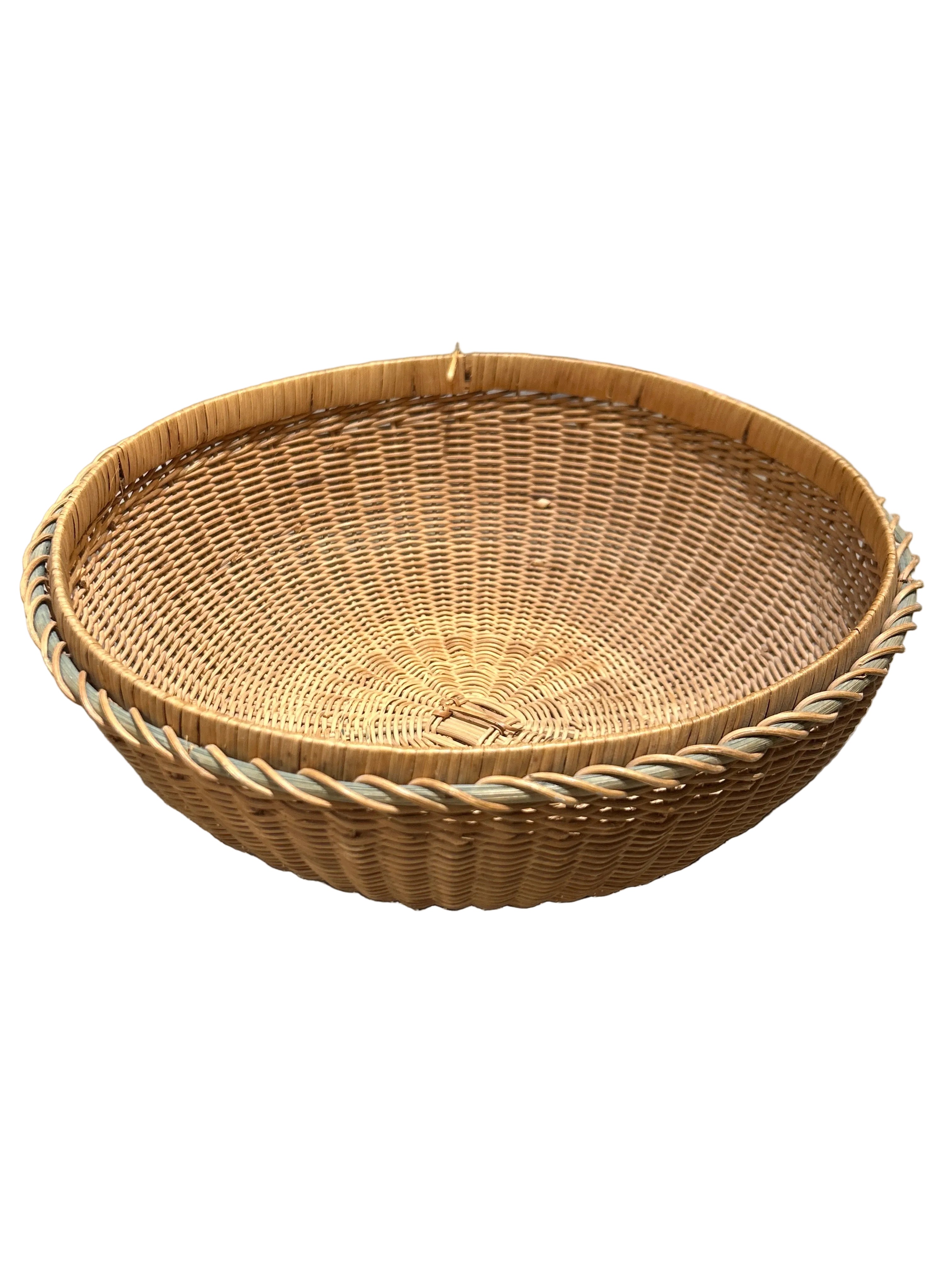 Vintage four-legged wicker basket with lid