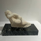 Female statue on Marble base