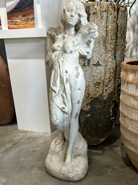 White concrete statue of woman