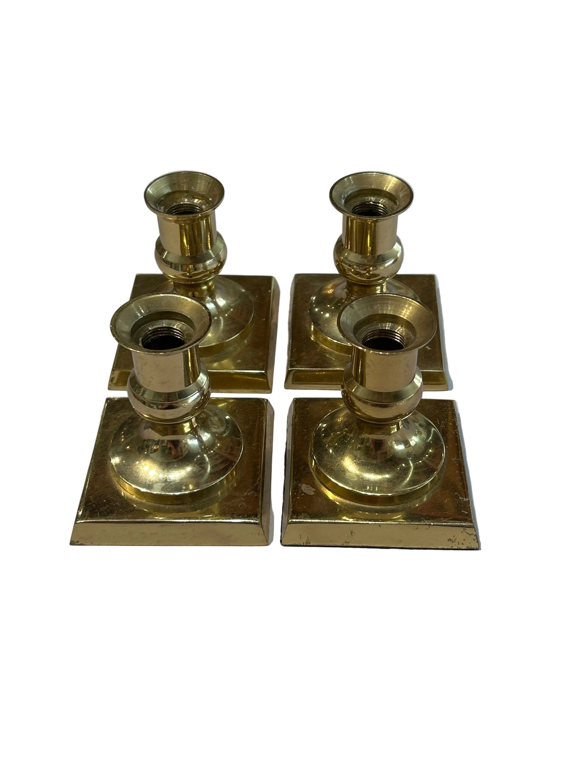 Vintage set of 4 brass footed candle holders