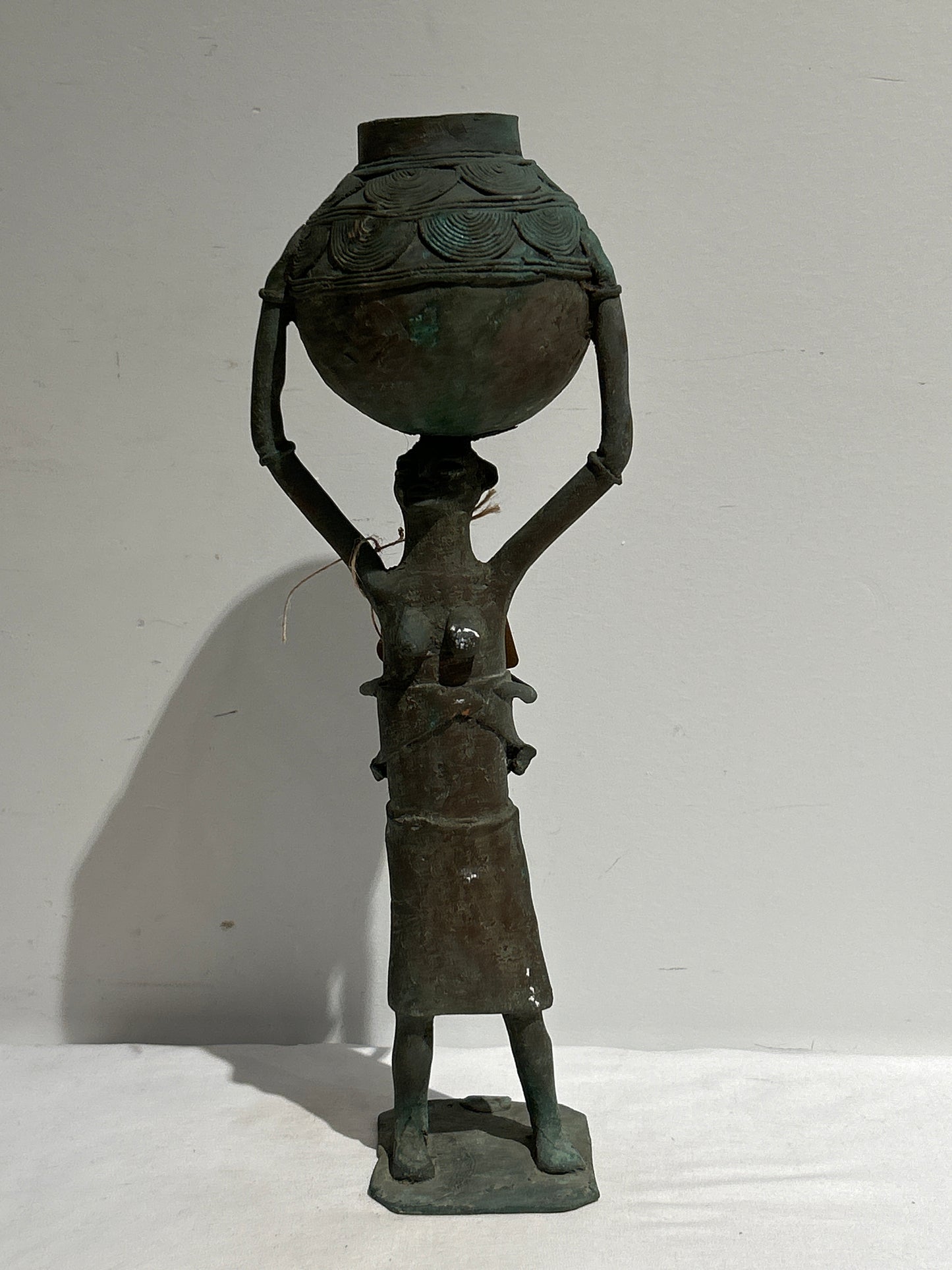 Metal sculpture of mother and baby