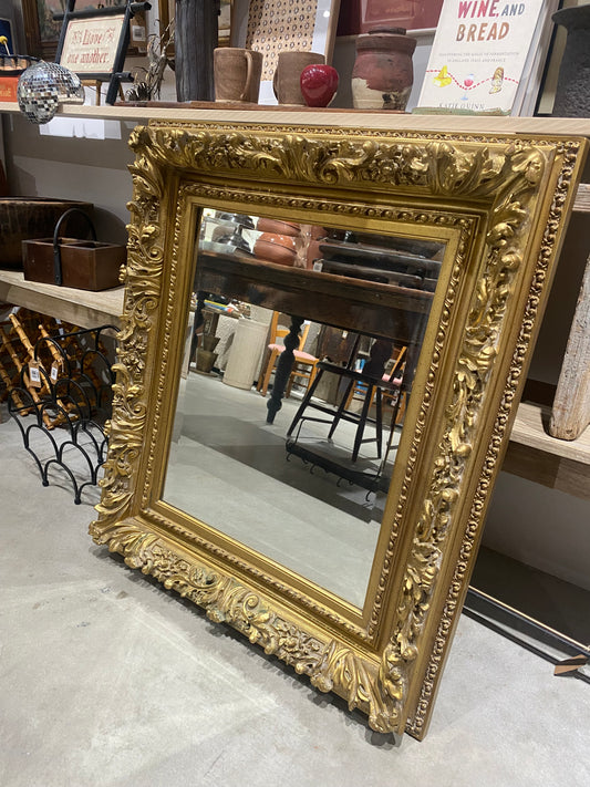 Ornate gold mirror