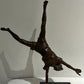 Vintage boy mid cartwheel statue