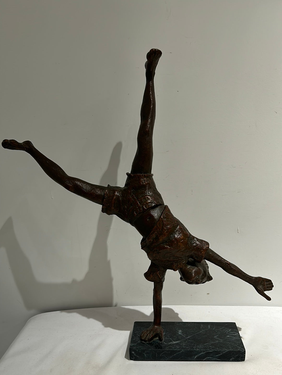 Vintage boy mid cartwheel statue