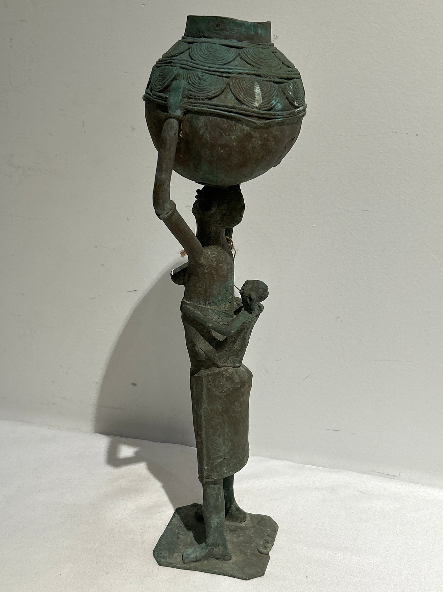 Metal sculpture of mother and baby