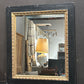 Vintage black and gold mirror