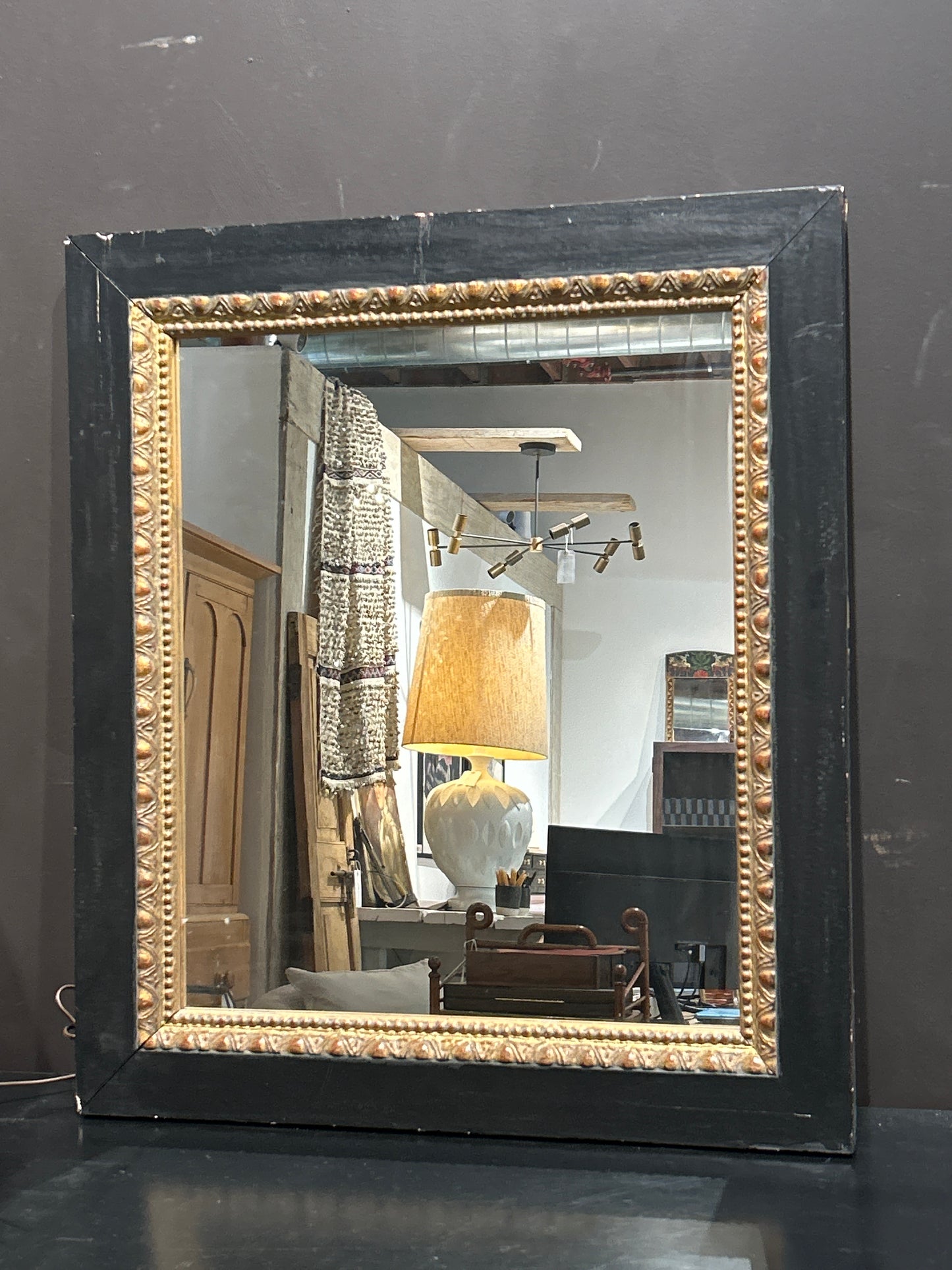 Vintage black and gold mirror