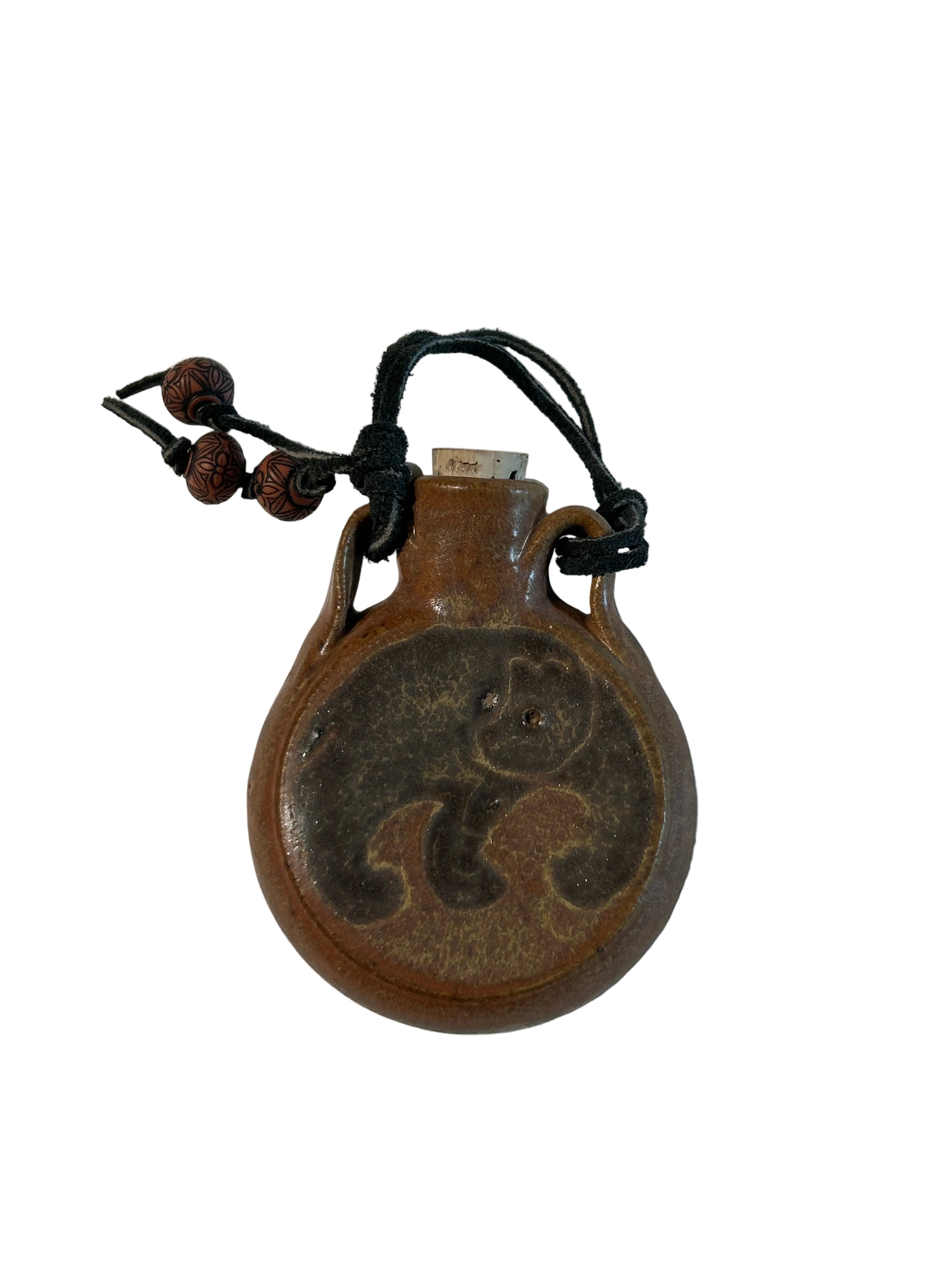 Vintage ceramic wall hanging flask with bear design
