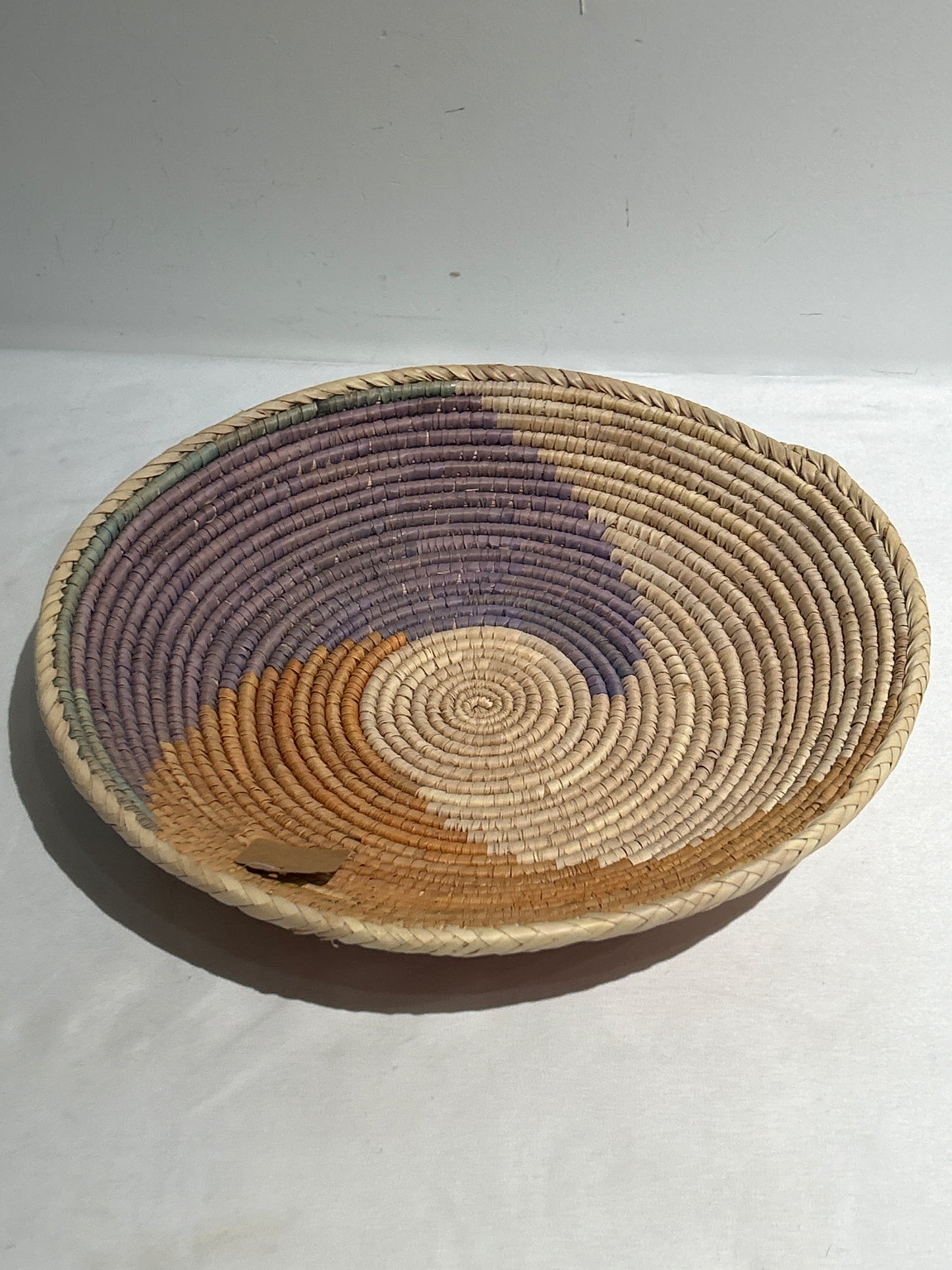 Woven basket with brown and purple