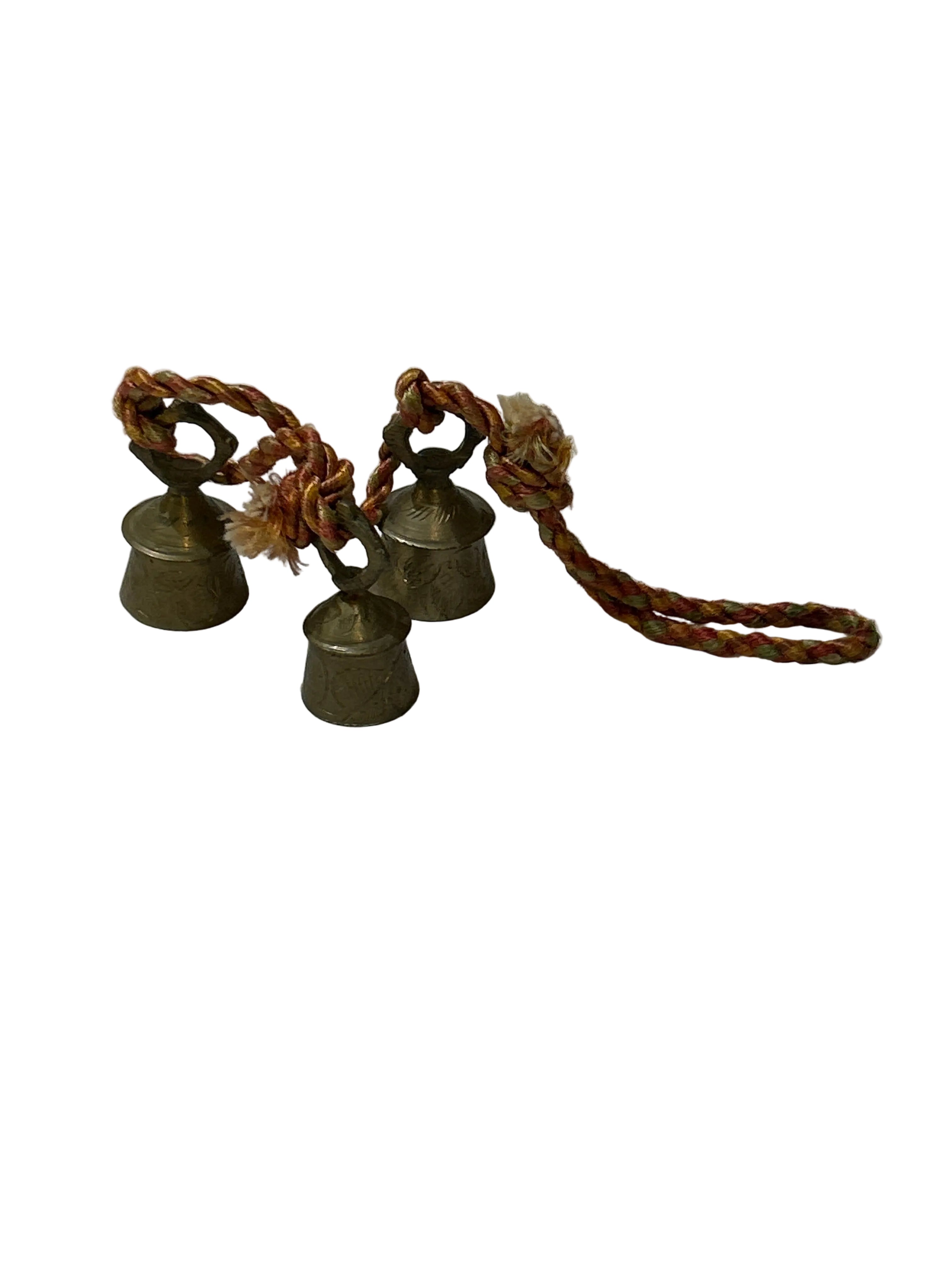 Vintage brass bells on orange cord