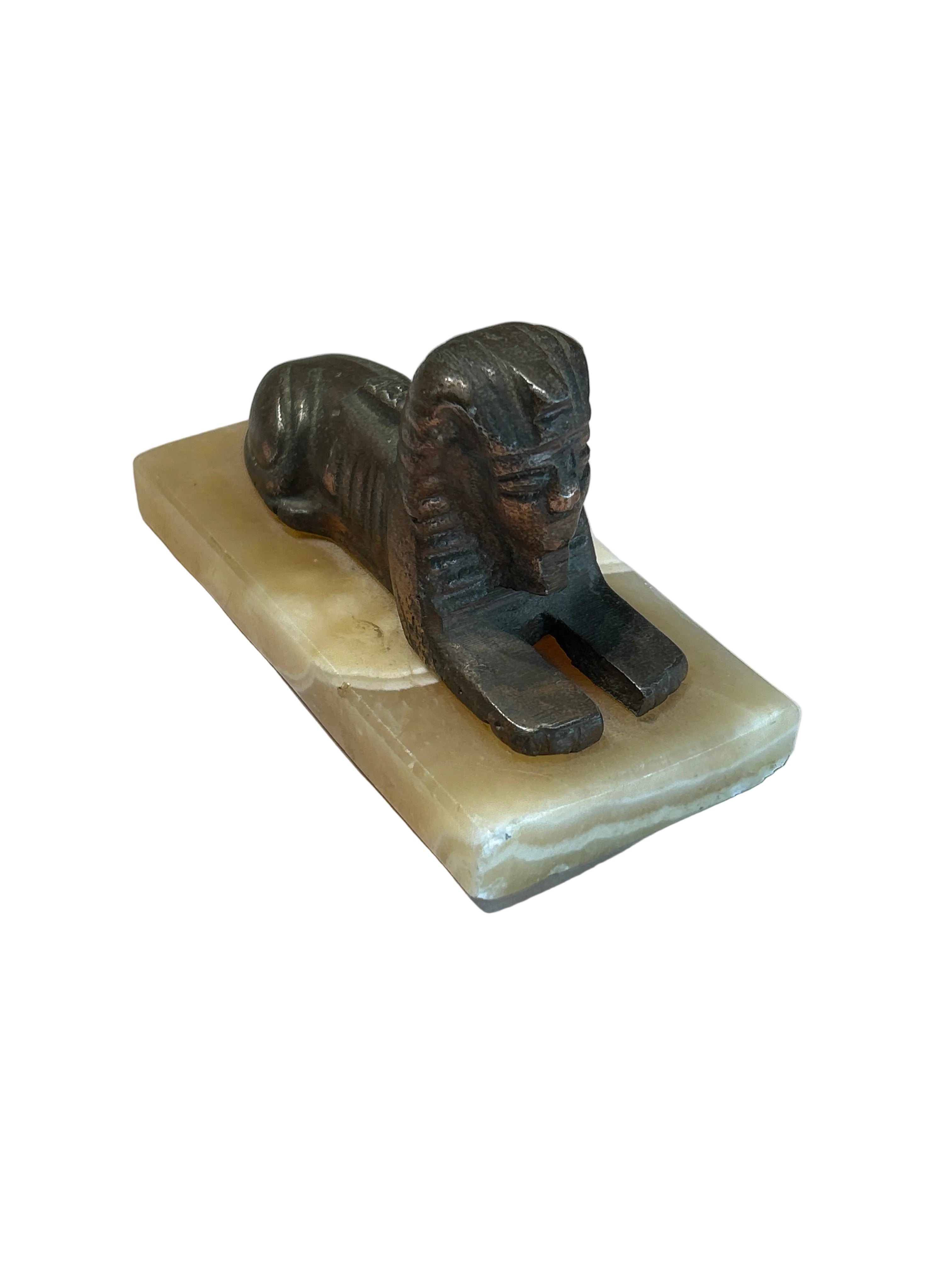 Vintage copper pharaoh figurine on onyx base