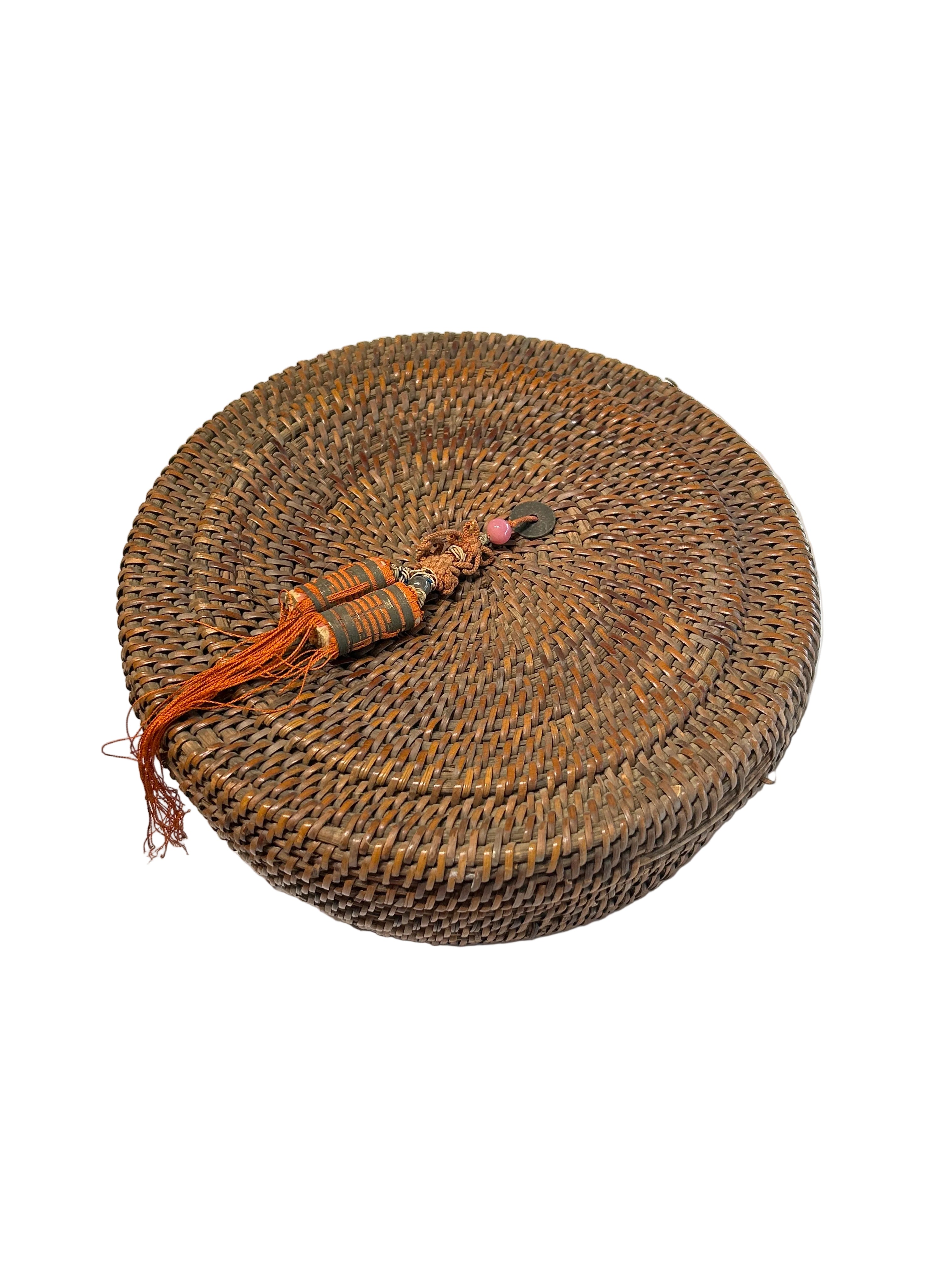 Vintage Asian rattan lidded basket with tassel