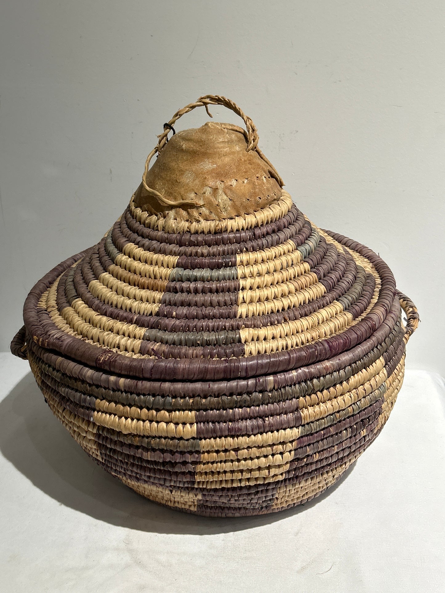 Large woven basket with lid