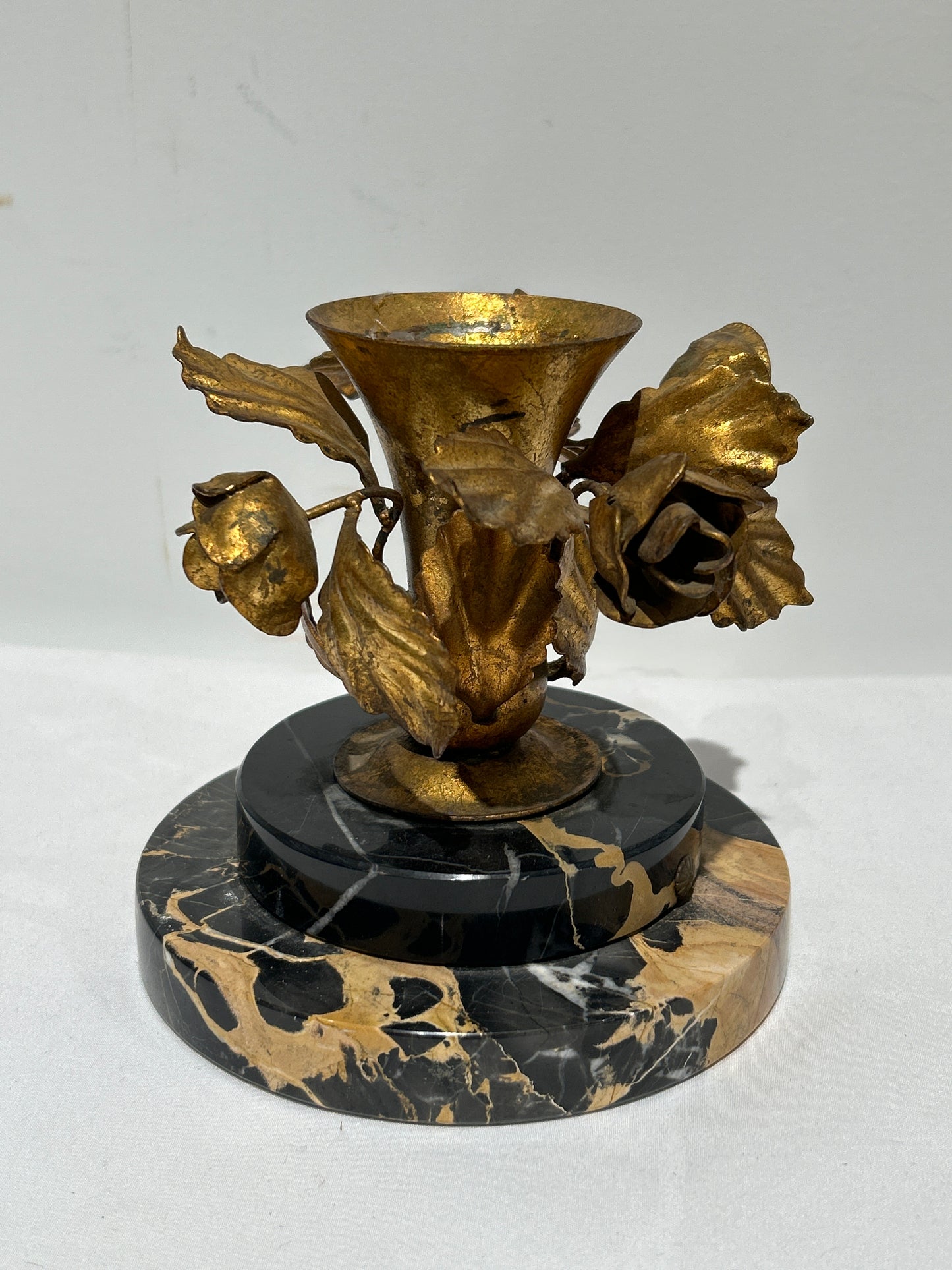 Vintage gilded rose candleholder on marble