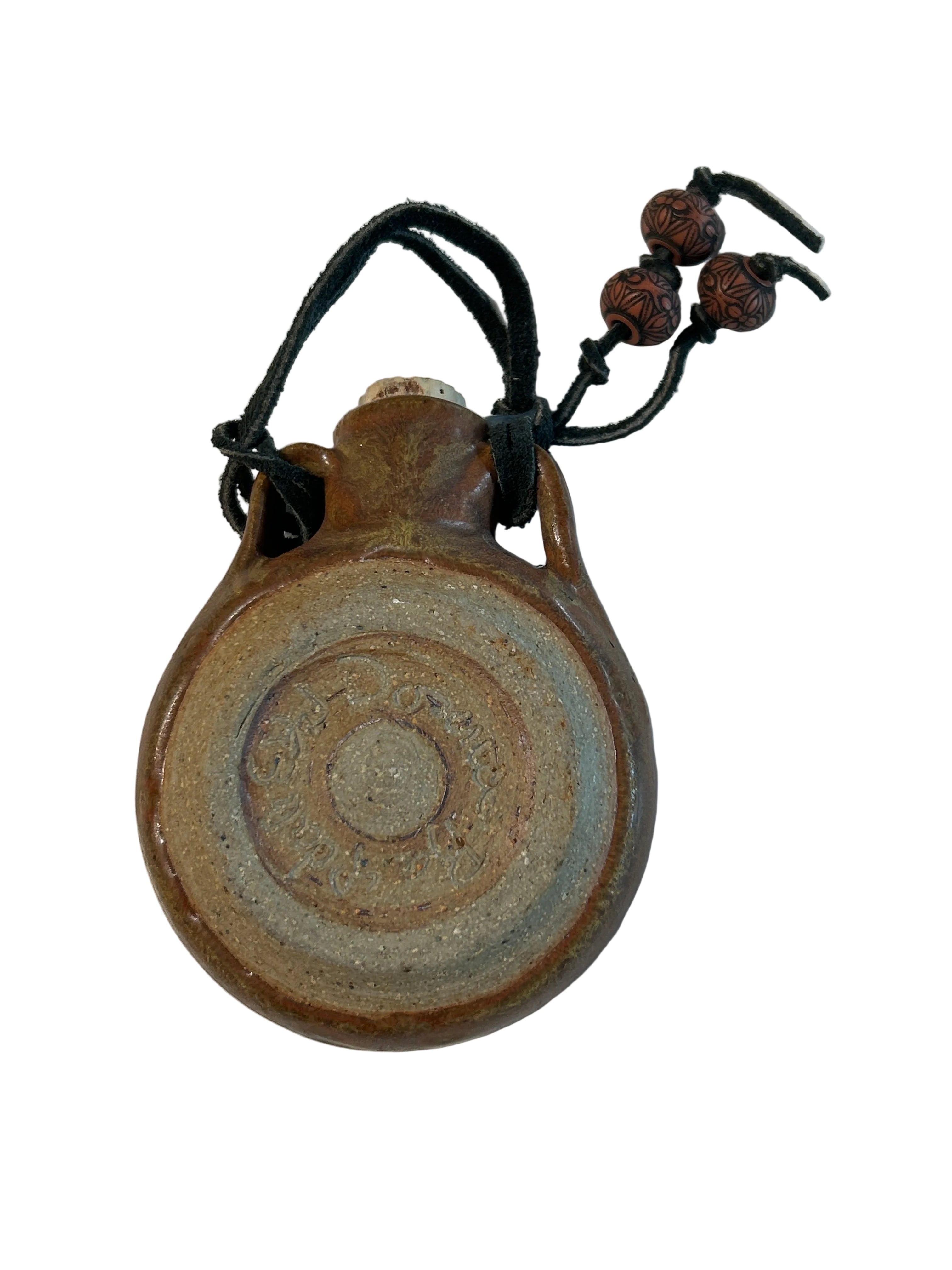 Vintage ceramic wall hanging flask with bear design