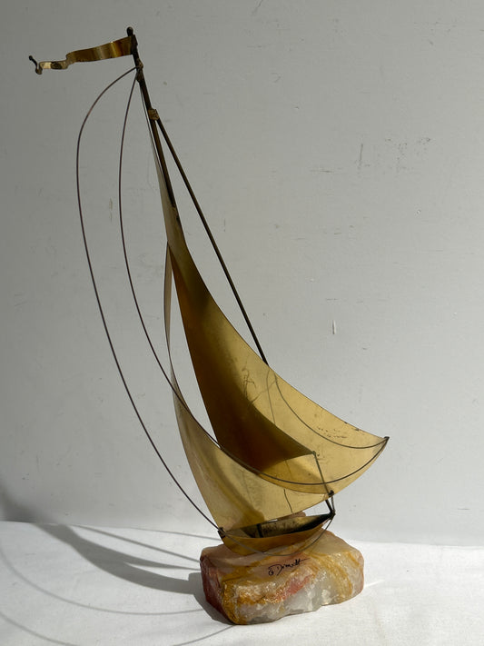 Brass sailboat on marble base