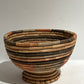 Woven basket with narrow base