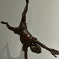 Vintage boy mid cartwheel statue