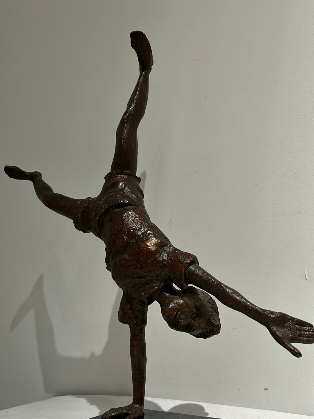 Vintage boy mid cartwheel statue