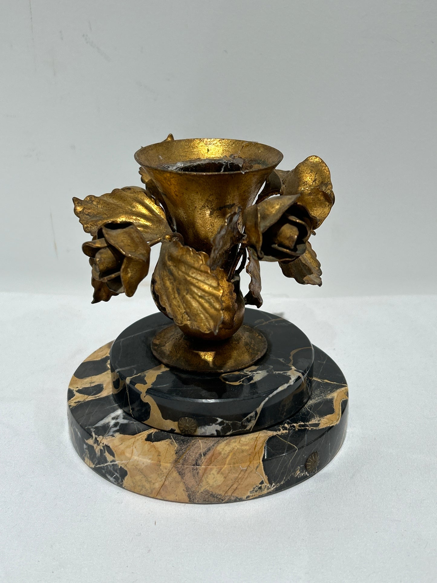 Vintage gilded rose candleholder on marble