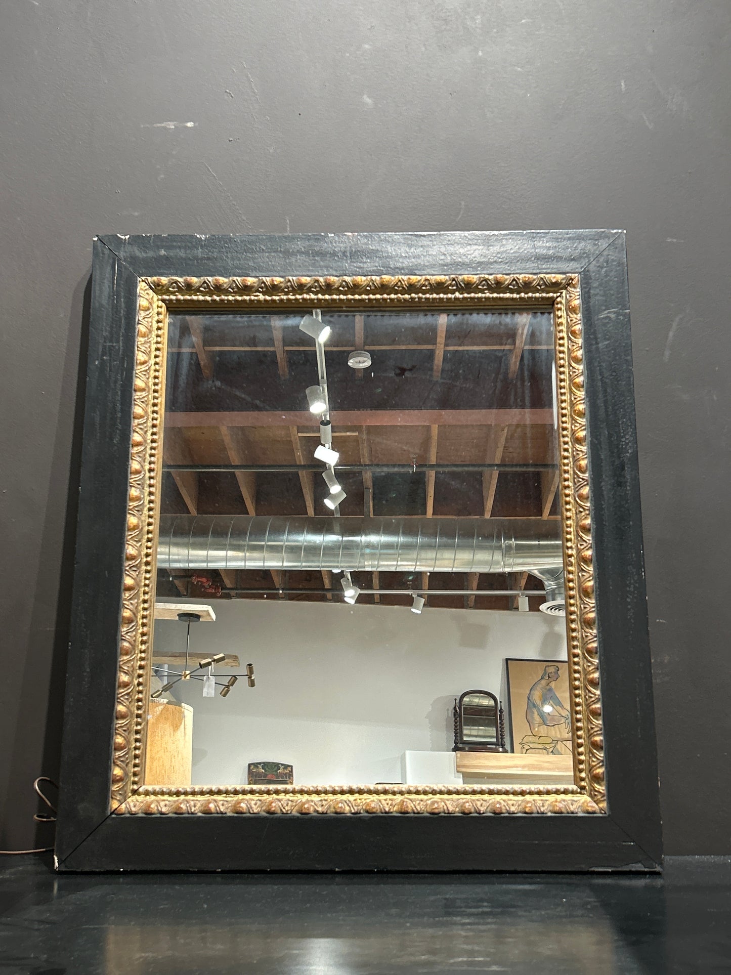 Vintage black and gold mirror