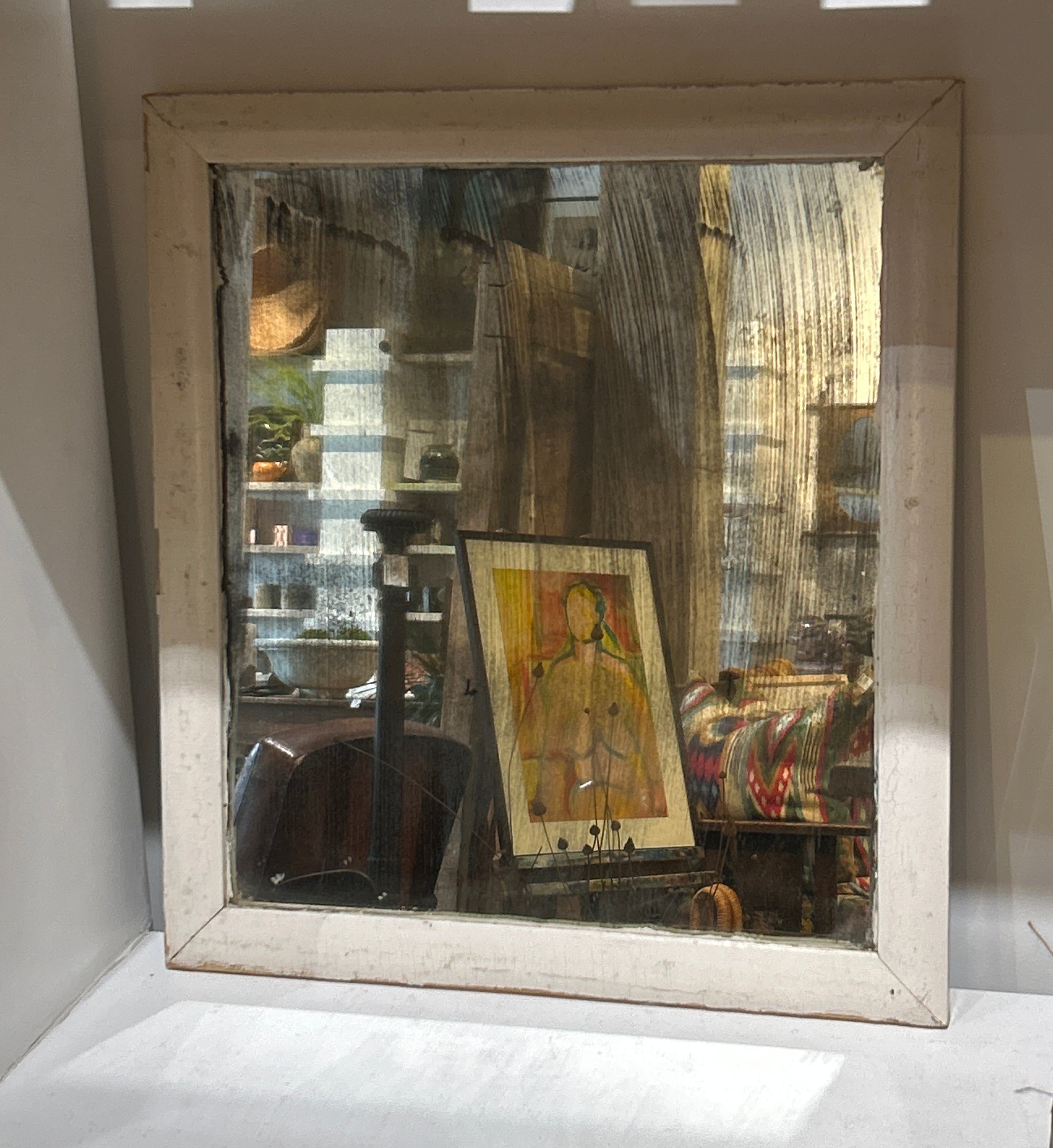 Vintage distressed mirror in white frame