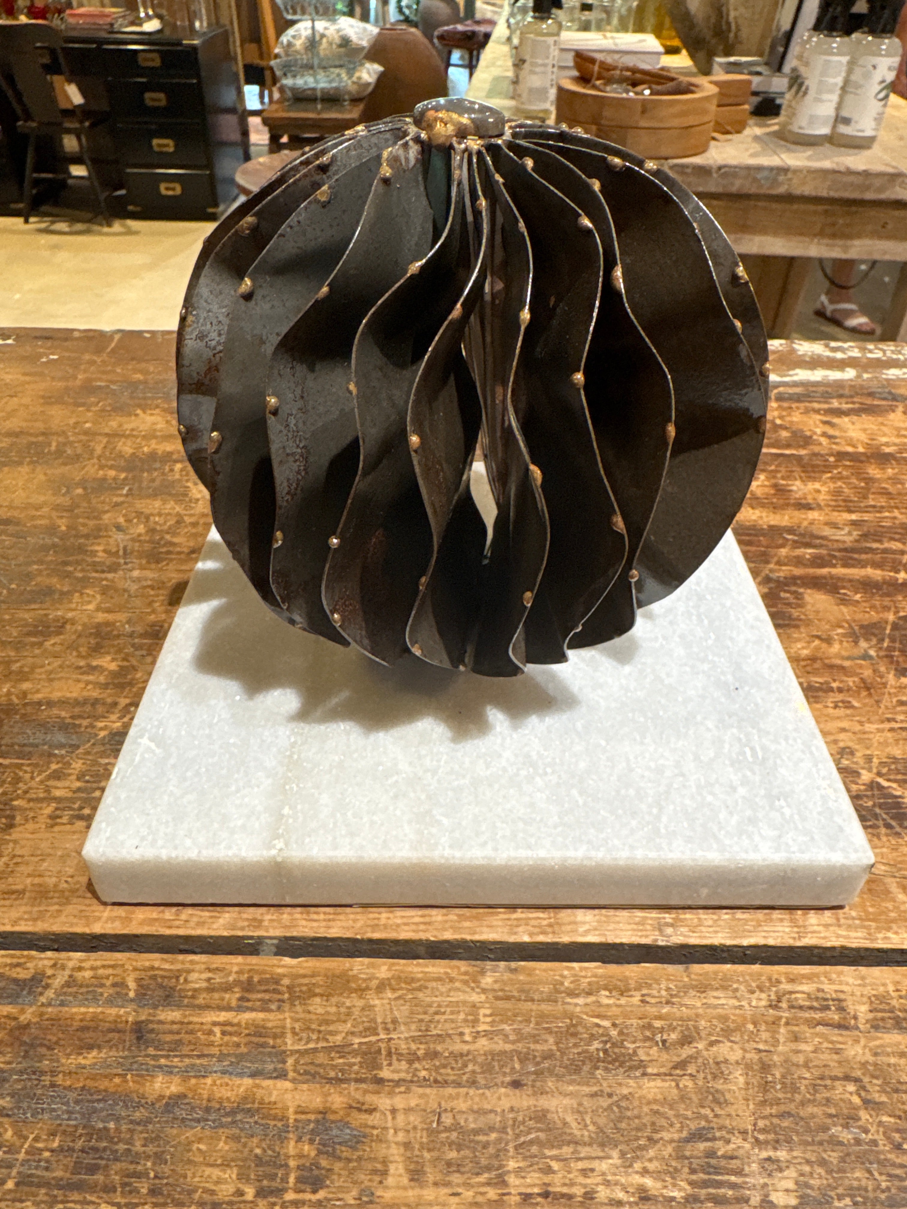 Iron Orb on White Marble