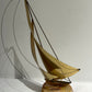 Brass sailboat on marble base