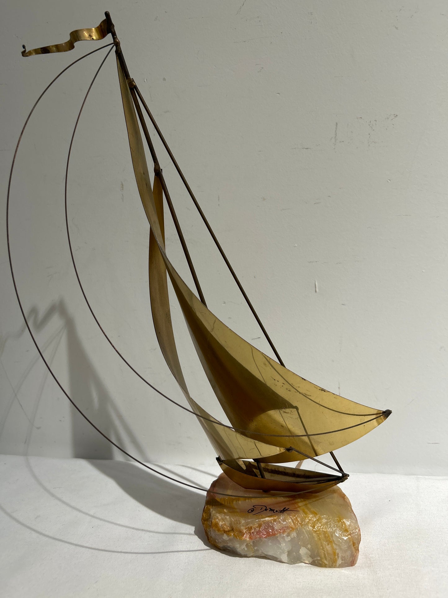 Brass sailboat on marble base