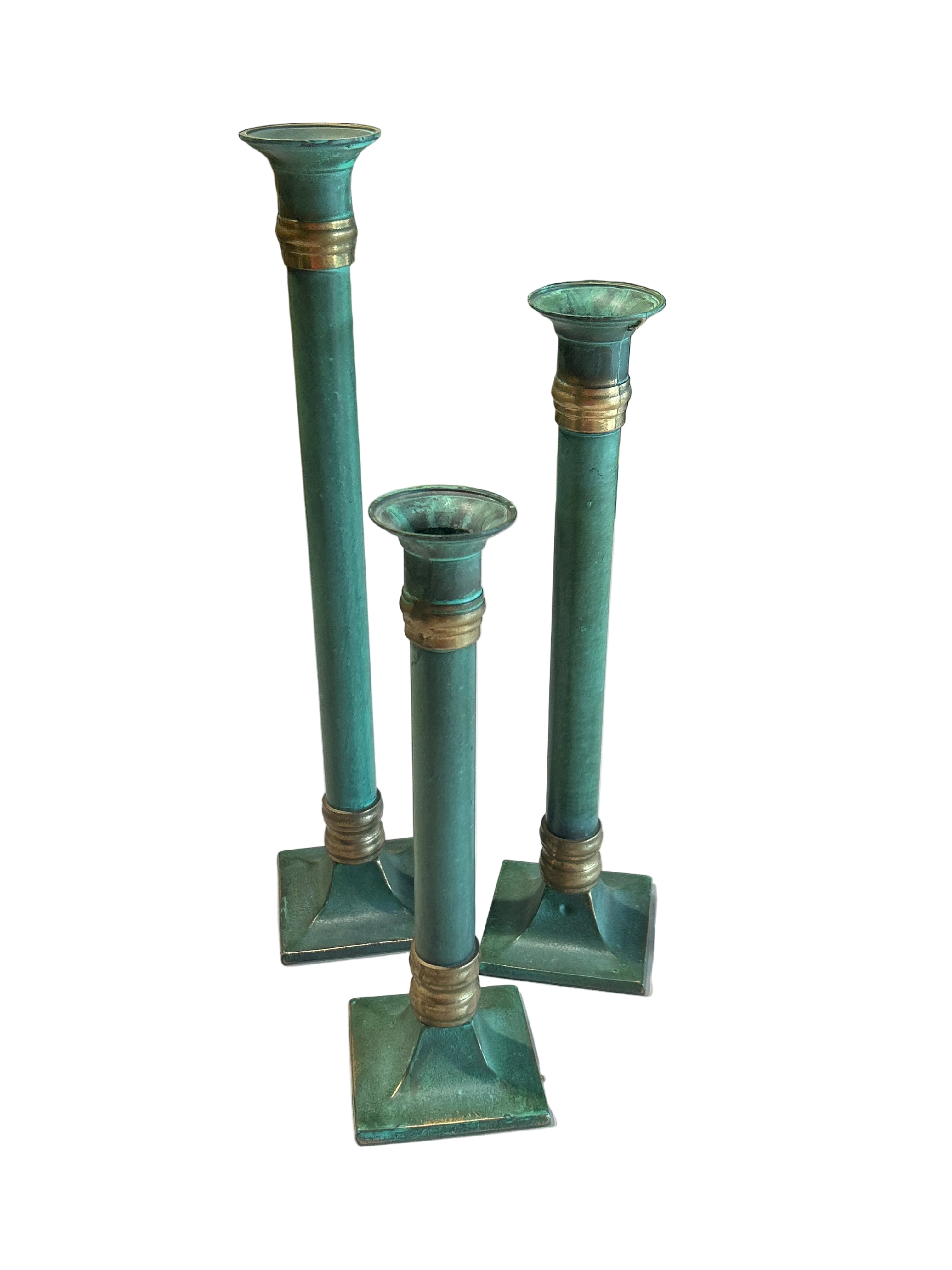 Vintage set of three patina’d brass candle holders