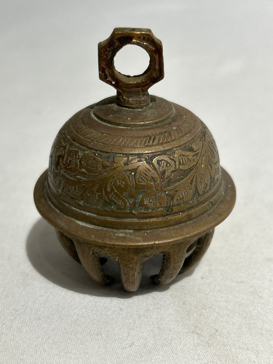 Ornate brass claw bell