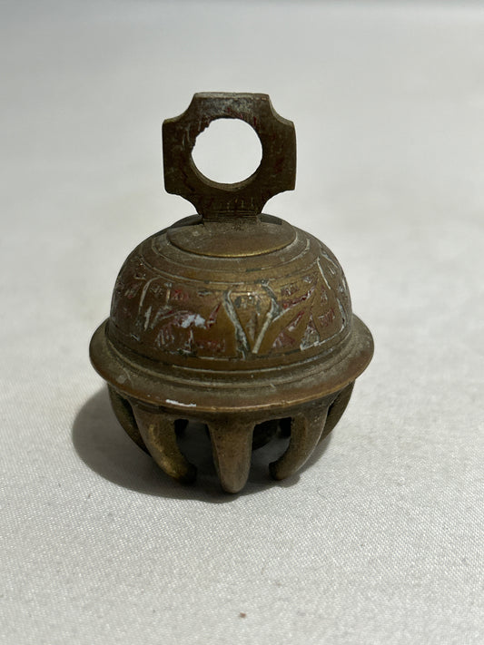 Small ornate brass claw bell