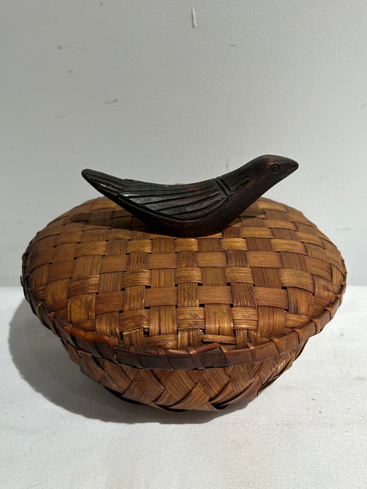 Woven lidded basket with wood bird