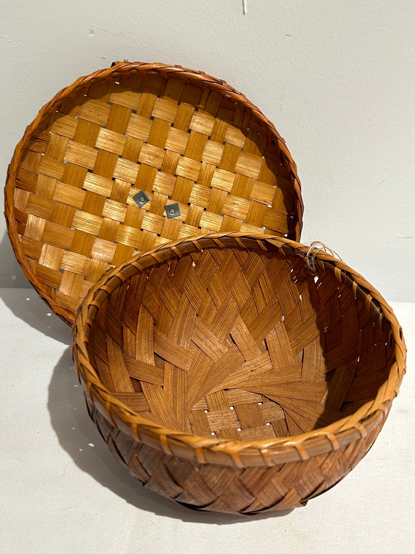 Woven lidded basket with wood bird