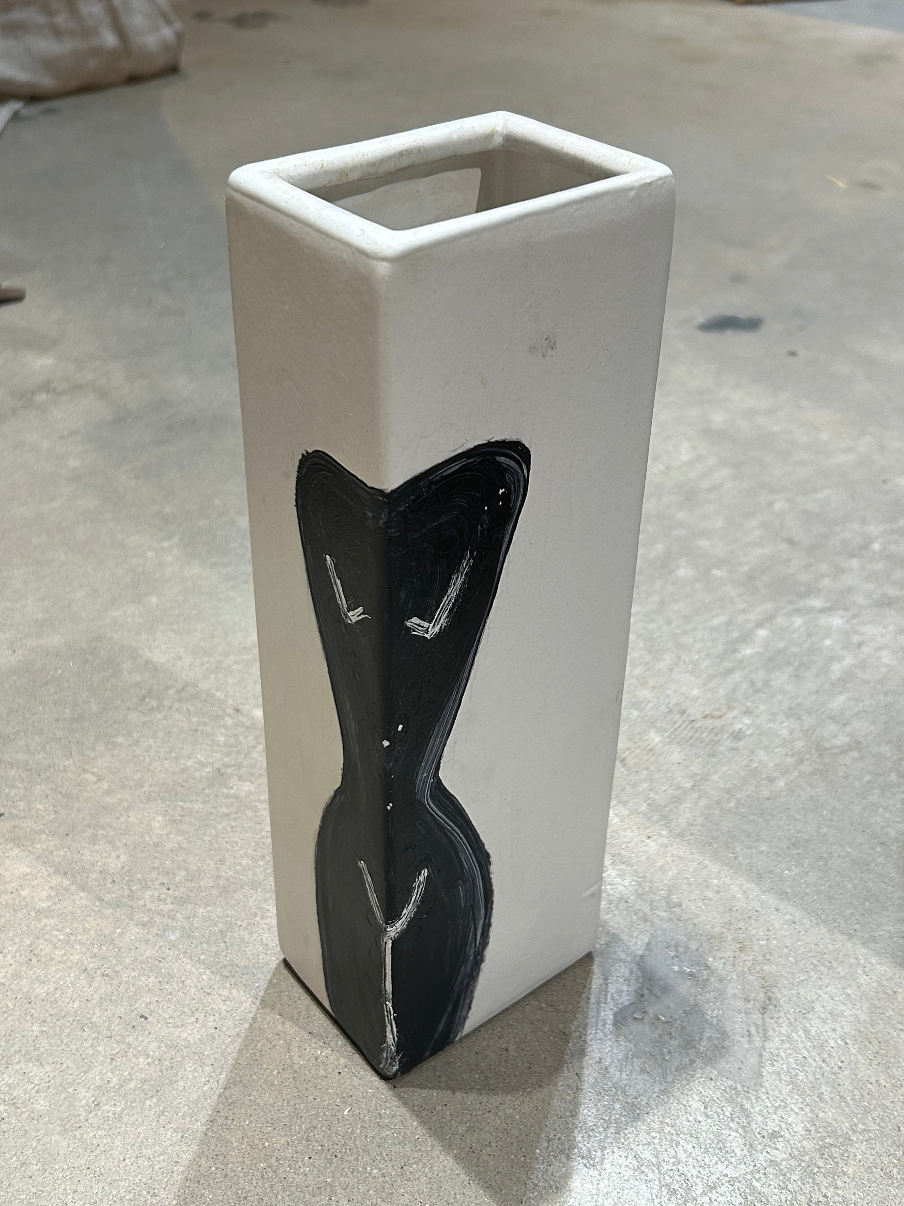 Vintage pottery vessel with painted female figure