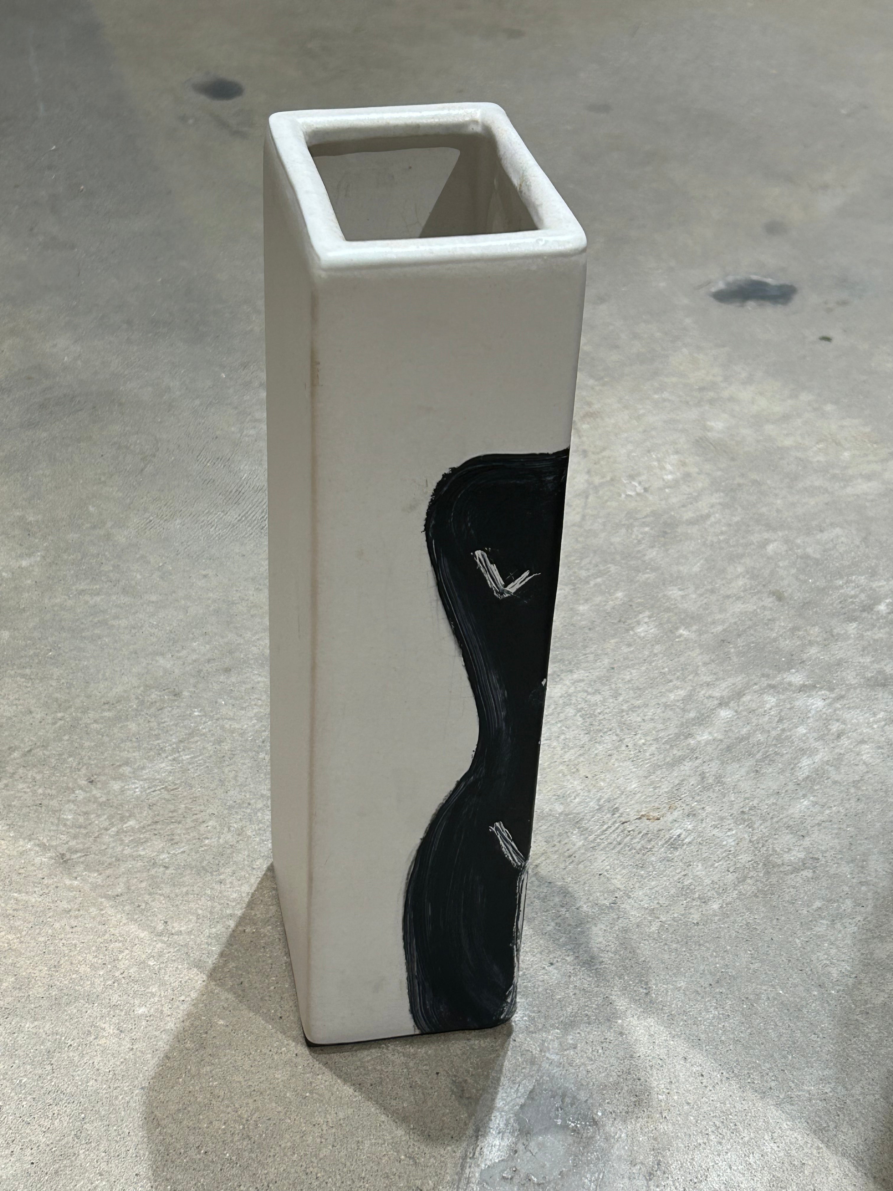 Vintage pottery vessel with painted female figure