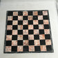 Vintage pink and black marble chess set