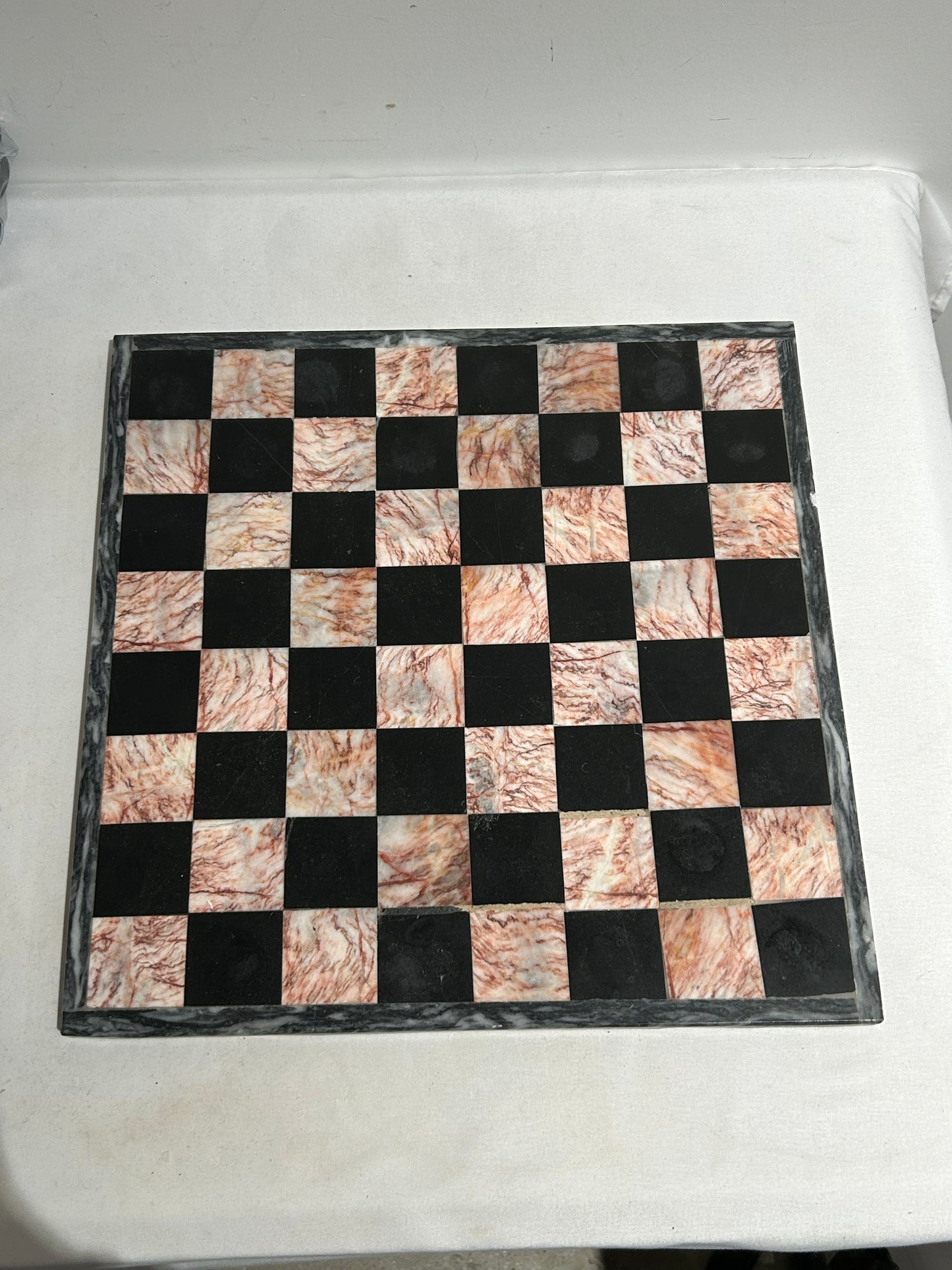 Vintage pink and black marble chess set