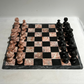 Vintage pink and black marble chess set