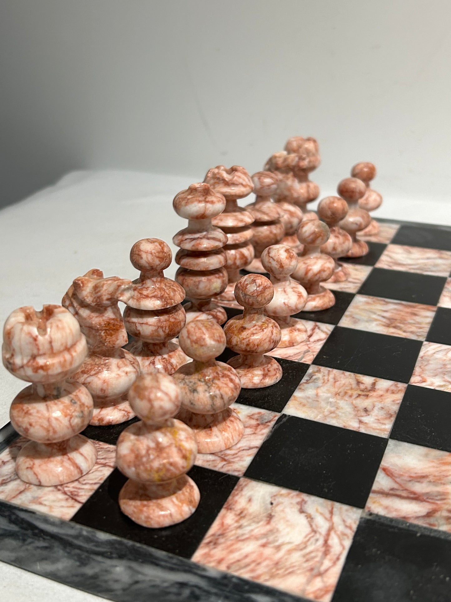 Vintage pink and black marble chess set