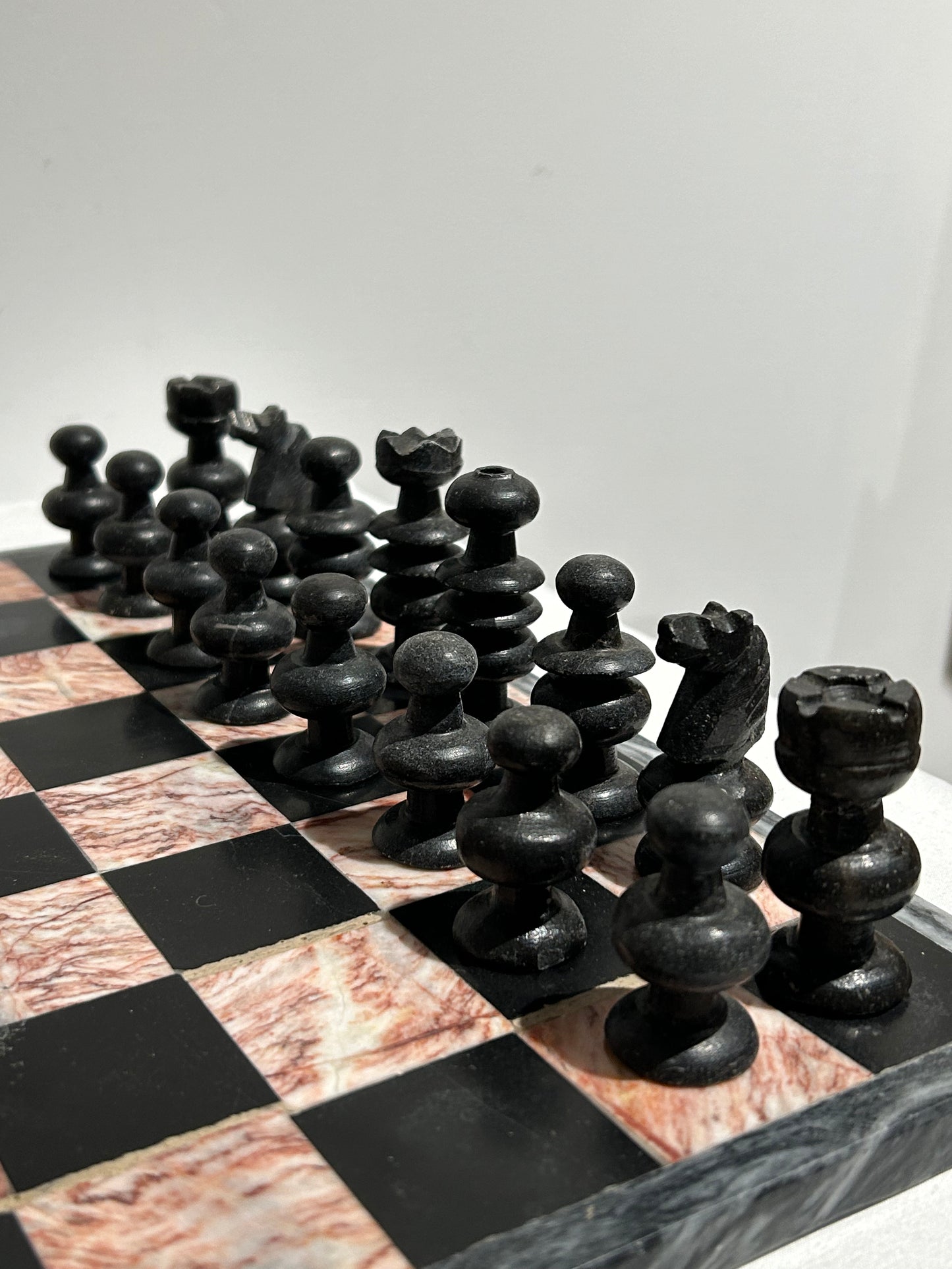 Vintage pink and black marble chess set