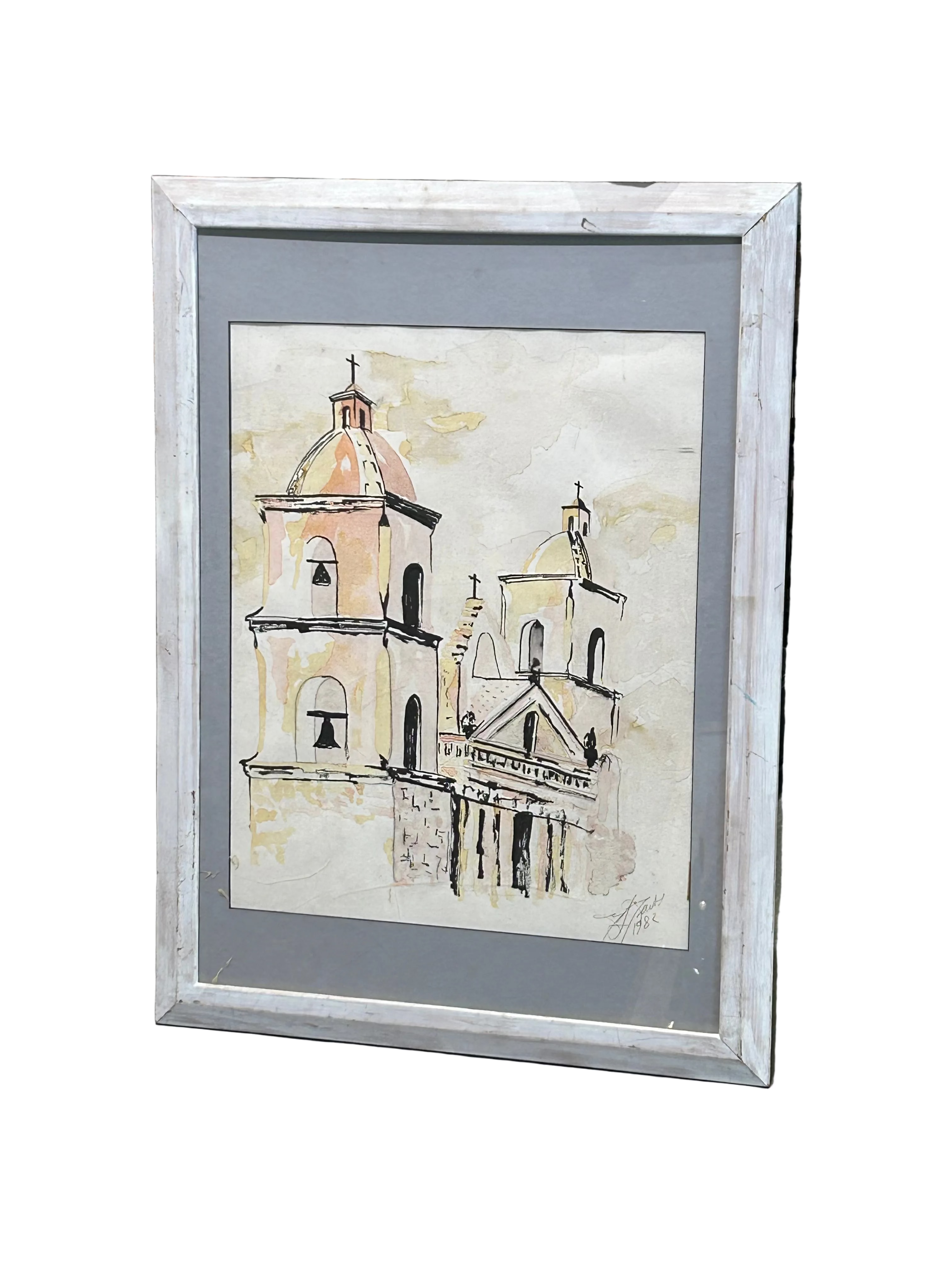 Spanish colonial mission in distressed white frame