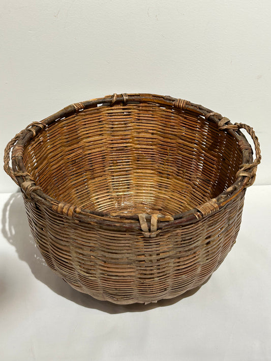 Vintage two-handled woven basket