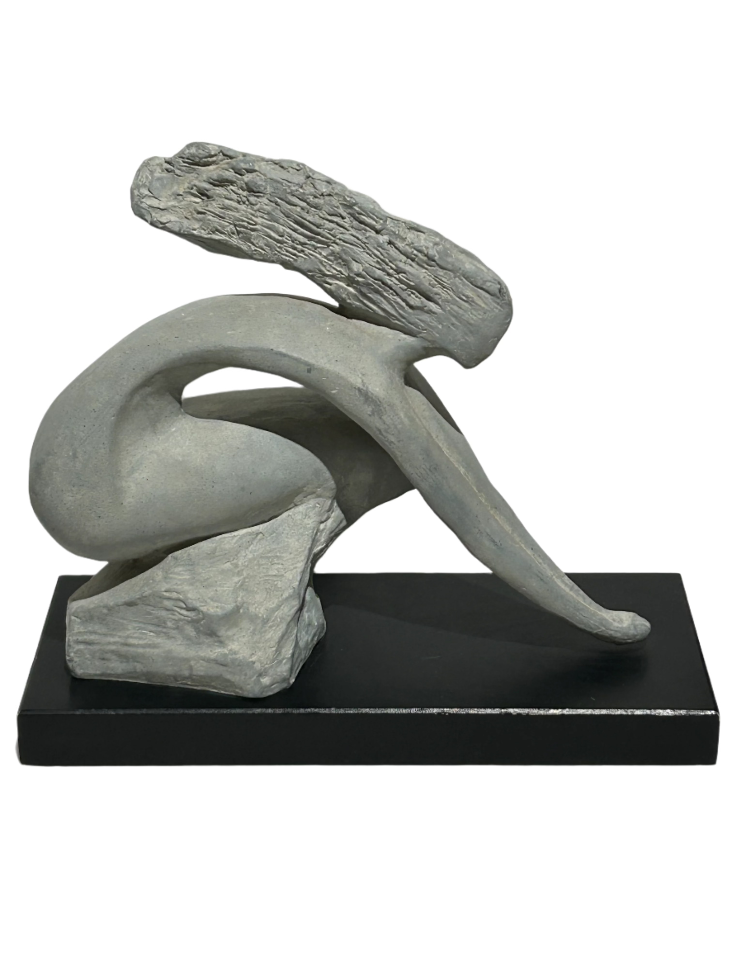 Vintage stone sculpture on wood